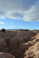 Cathedral Gorge State Park on a cold day in December with fresh snow, located in a long, narrow valley in southeastern Nevada, where erosion has carved patterns in bentonite clay