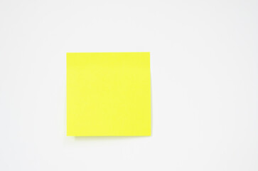 Green paper on white background.