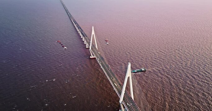 Aerial view of Hangzhou Bay Bridge scenery at sunset, Zhejiang Province, China. The total length of the bridge is 36 kilometers. The design speed is 100 kilometers per hour.