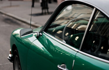 classic green car.