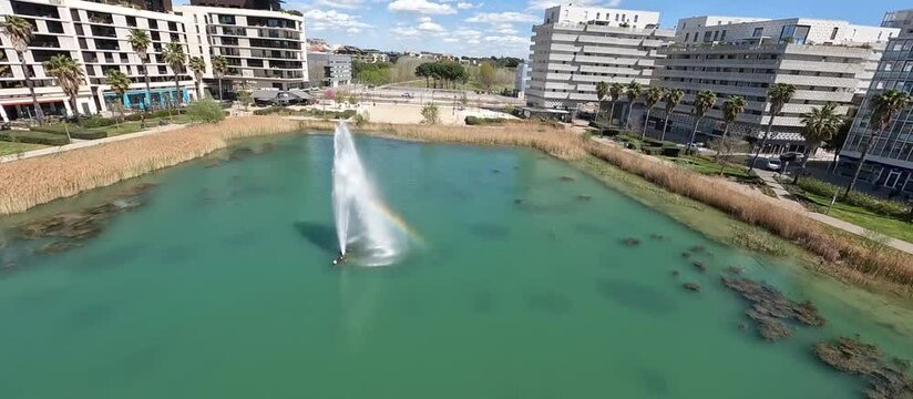 FPV Drone shot over a basin, Montpellier city, south of France.