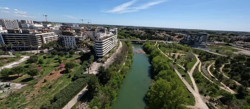 FPV Drone shot over a basin, Montpellier city, south of France.