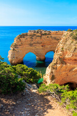 tou tourism in Portugal, travel destination in Algarve,  beautiful beach and coast with heart shaped rock formation- praia da marinah