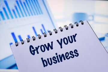 Notepad with the inscription Grow your business.