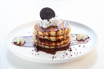 Chocolate pancakes with cookies and cream.