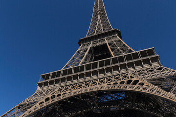 central part of Eiffel Tower against blue sky