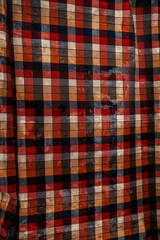 Creative image of wet rumpled plaid material, underwater with waves, for your stylish design or illustrations.