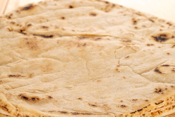 One baked delicious pita bread, close-up.