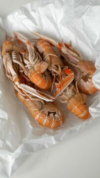 Fresh prawns and oysters from fish market in paper
