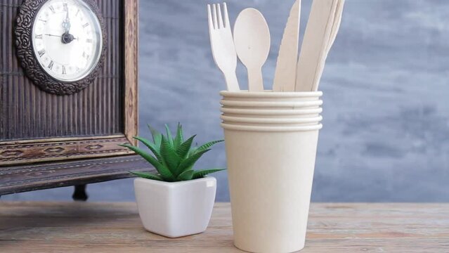 Zero waste, plastic free,recyclable, sustainable utensils including fork, spoon, knife, cups, napkin and a bag with copy space. Can be used as a food delivery ad...