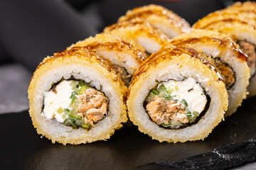 Sushi roll on dark background. Japanese and asian food concept