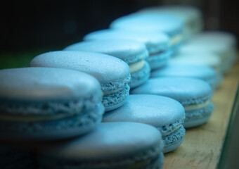  French blue macrons arranged ready to eat. Selective focus.