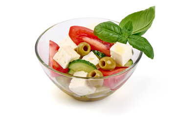 Vegetable salad with feta cheese, tomatoes, isolated on white background. High resolution image.