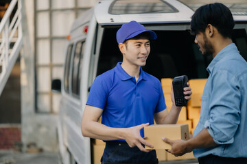Asian delivery man, Hand using smart phone to scan QR code on tag, concept of parcel delivery, Qr code payment concept.
