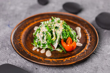 Traditional Japanese wakame salad with sesame seeds - asian food. Healthy and fresh seaweed salad