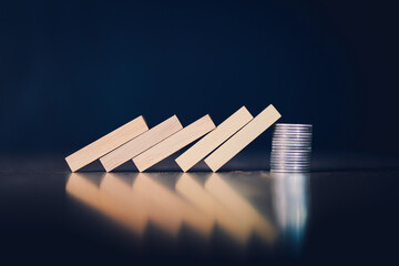 Wooden blocks and coins failed in background business idea for text