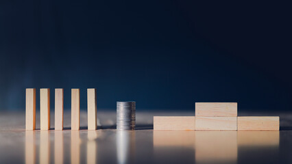 Wooden blocks and coins failed in background business idea for text