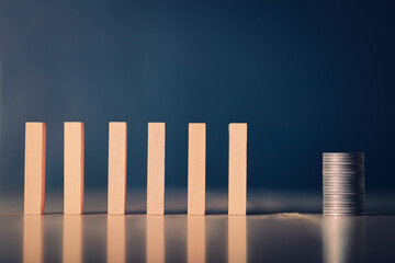 Wooden blocks and coins failed in background business idea for text