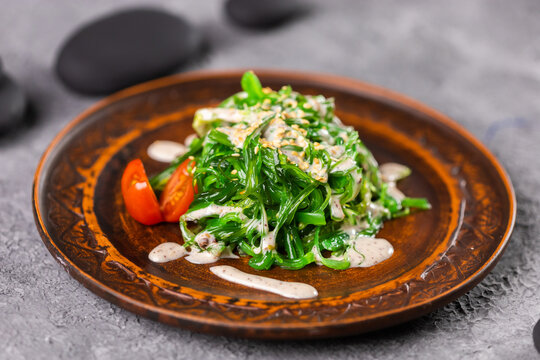 Traditional Japanese wakame salad with sesame seeds - asian food. Healthy and fresh seaweed salad