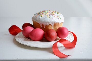 Easter eggs and cake on plate