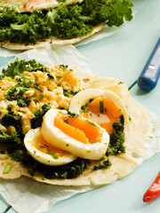 Pitas with eggs and greens