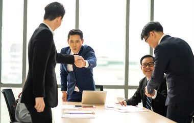 Image two business partner meeting successful handshake together with success join congratulation good deal contract in modern office.Partnership approval and teamwork concept