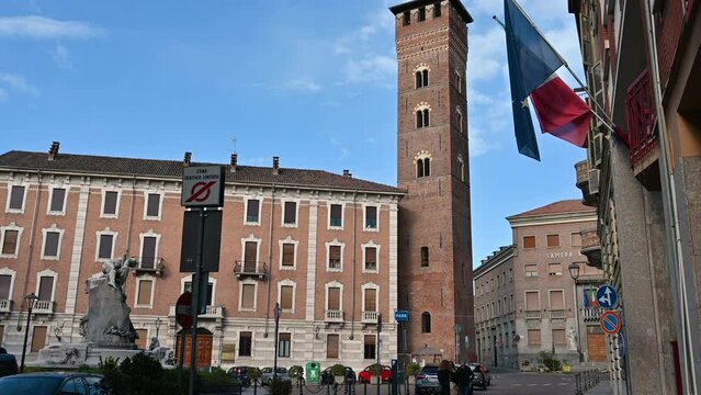 Asti, Italy, April 2023. Footage of the Trojan tower which dominates Piazza Medici with its 44 meters high, from the Middle Ages is perfectly preserved. Beautiful spring day.
