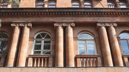 Close up front view of the old building in Yerevan concept photo. Urban architectural photography.