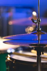 Fototapeta na wymiar Drum cymbal close-up on a dark blurred background.