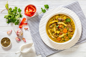 gungo peas soup with dumplings, veggies and beef