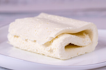 Cow's cream for breakfast. Fresh and organic clotted cream or butter cream. Milk product. Close up