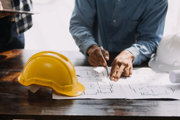 Two business man construction site engineer. Engineering objects on workplace with partners...