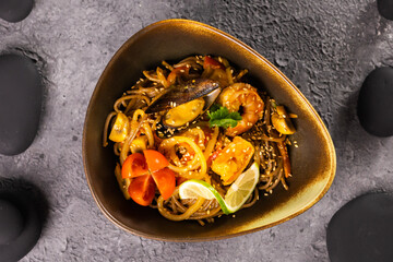 Udon stir-fry noodles with mussels and shrimp. Asian cuisine