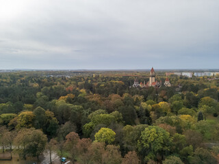 Fototapeta premium High angle view of Leipzig city in Germany. Panorama of the greenery during autumn season.