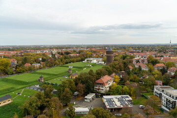 Fototapeta premium High angle view of Leipzig city in Germany. Panorama of the greenery during autumn season.