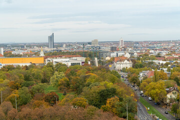 High angle view of Leipzig city in Germany. Panorama of the greenery during autumn season.