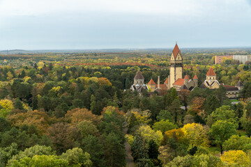 Naklejka premium Sudfriedhof cemetery park during the autumn season with colorful trees and foliage