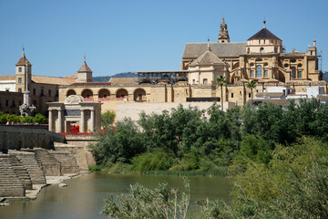 Fototapeta na wymiar Roman bridge on Guadalquivir River and Mezquita Mosque - Cathedral in Cordoba, Spain