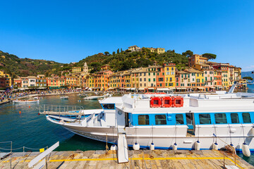 Famous village of Portofino, luxury tourist resort in Genoa Province, Liguria, Italy, Europe. Port and colorful houses, Mediterranean sea (Ligurian sea). - obrazy, fototapety, plakaty