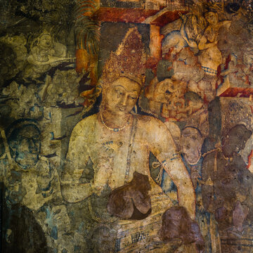 The 5th-century Bodhisattva Padmapani painting depicting the Buddha holding a lotus flower at Ajanta caves, Maharashtra, India.