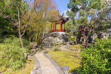 Path leading to a small chinese temple in the botanical garden of Haren, Netherlands