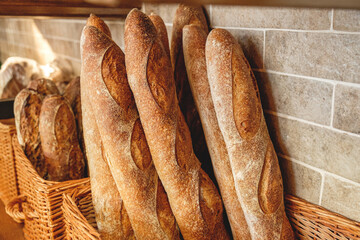 Fresh tasty Baguettes  in a basket . French Baguette bread for sale in a bakery shop. Concept of french delicious food