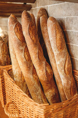 Fresh tasty Baguettes  in a basket . French Baguette bread for sale in a bakery shop. Concept of french delicious food
