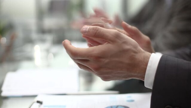 Business people celebrating clapping hands applause successful financial growth in office