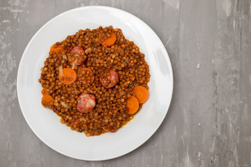 Lentils with chorizo and carrot. Typical Spanish recipe.
