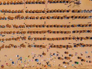 Aerial drone photo of famous organised with sun beds and umbrellas beach of Lia with emerald clear...