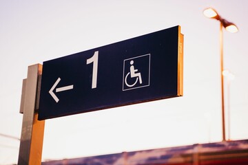 Closeup of a street sign with the disability, wheelchair sign