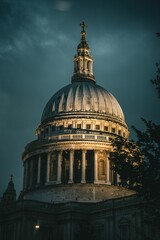 Fototapeta na wymiar Vertical shot of the illuminated St. Paul's Cathedral under a cloudy sky in London, UK