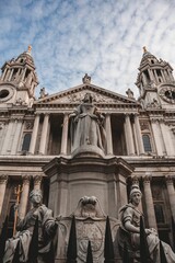 Vertical shot of the Statue of Queen Anne in St. Paul's Churchyard in the daytime in London, UK