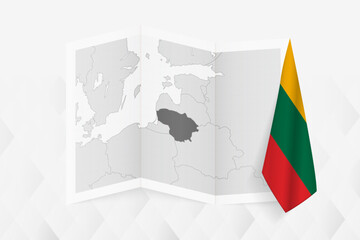 A grayscale map of Lithuania with a hanging Lithuanian flag on one side. Vector map for many types of news.